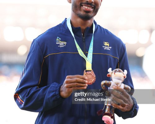 BIRMINGHAM, ENGLAND - AUGUST 04: Bronze medalist Yupun Abeykoon of Team Sri Lanka poses for a photo during the medal ceremony for the Men's 100m Final on day seven of the Birmingham 2022 Commonwealth Games at Alexander Stadium on August 04, 2022 in Birmingham, England. (Photo by Michael Steele/Getty Images)