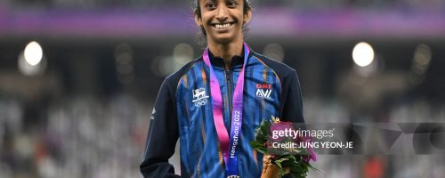 Gold medallist Sri Lanka's Tharushi Karunarathna celebrates on the podium during the medal ceremony for the women's 800m final athletics event during the 2022 Asian Games in Hangzhou in China's eastern Zhejiang province on October 4, 2023. (Photo by JUNG Yeon-je / AFP) (Photo by JUNG YEON-JE/AFP via Getty Images)