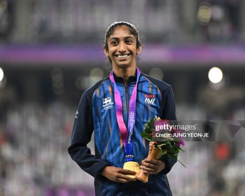 Gold medallist Sri Lanka's Tharushi Karunarathna celebrates on the podium during the medal ceremony for the women's 800m final athletics event during the 2022 Asian Games in Hangzhou in China's eastern Zhejiang province on October 4, 2023. (Photo by JUNG Yeon-je / AFP) (Photo by JUNG YEON-JE/AFP via Getty Images)